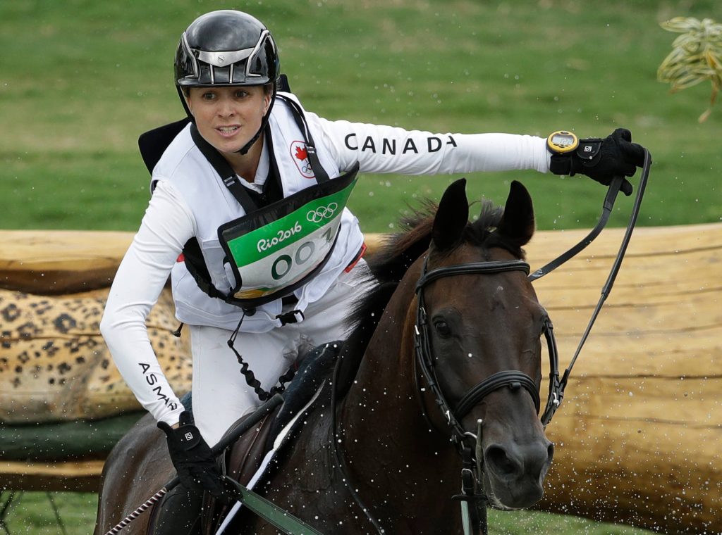 Jessica Phoenix riding dark horse over water obstacle cross country 2016 Rio Olympics eventing Wallpaper