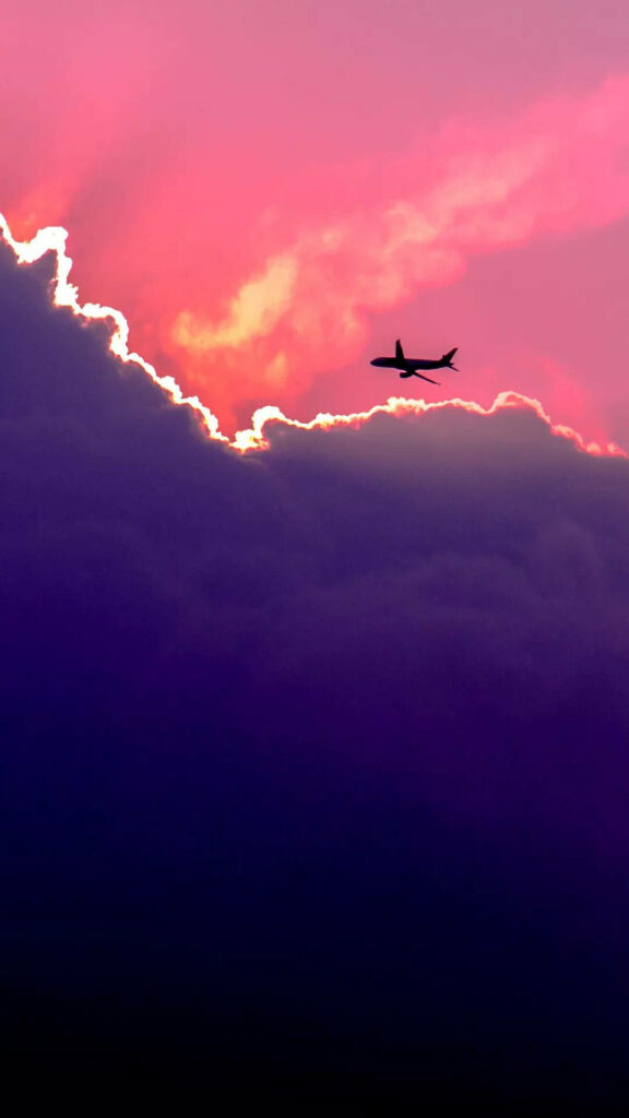 Mesmerizing Airborne Journey: A Captivating Airplane Wallpaper for Your iPhone
