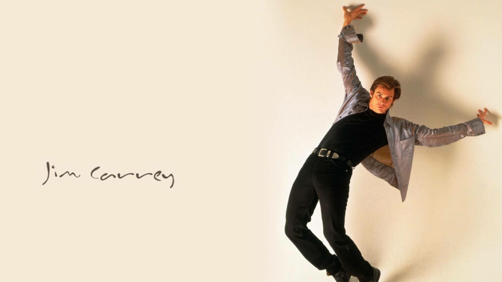 Jim Carrey playful exaggerated pose energetic expression light background wallpaper image