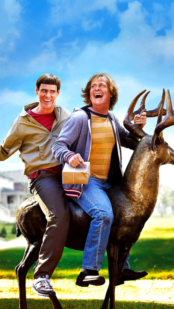Jim Carrey and Jeff Daniels as Dumb and Dumber riding deer statue with playful goofy expressions Wallpaper