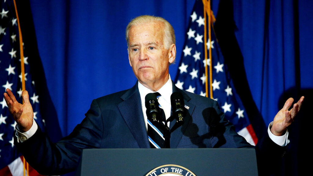 Joe Biden's Powerful Women's Rights Statement with American Flags Wallpaper