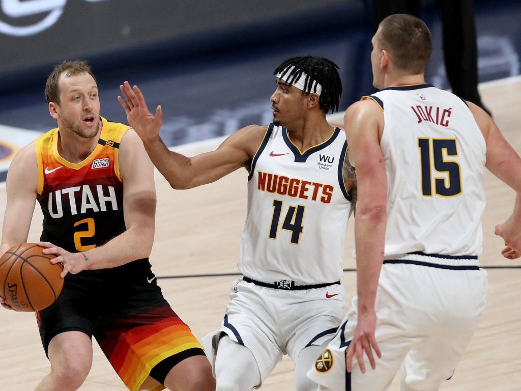 Utah Jazz Joe Ingles defending against Denver Nuggets Gary Harris and Nikola Jokic NBA action wallpaper