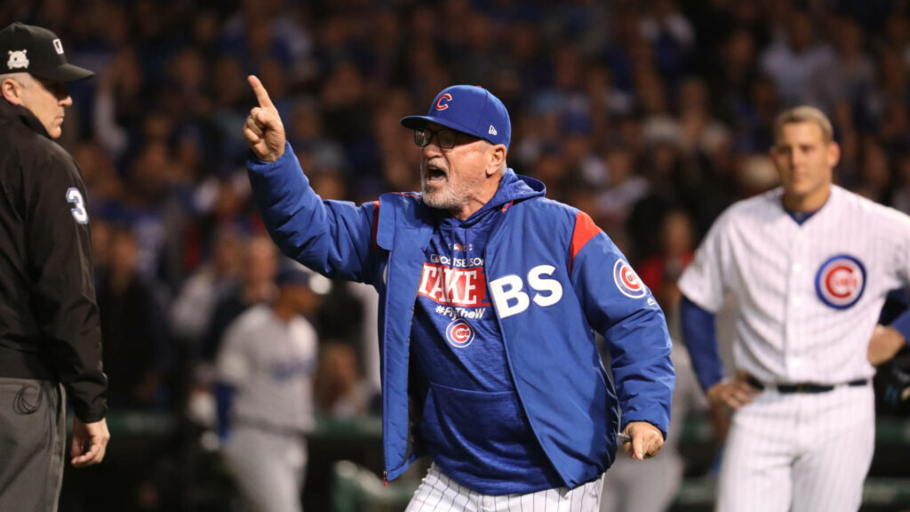 Joe Maddon arguing with umpire on field Anthony Rizzo watching during Chicago Cubs baseball game Wallpaper
