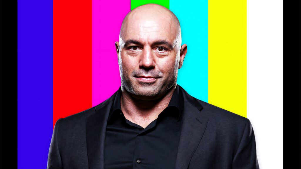 Joe Rogan confidently stands before vibrant TV testing background creating dynamic wallpaper