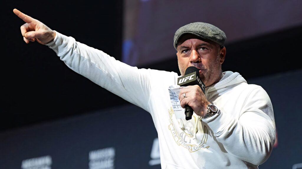 Joe Rogan passionately speaking at UFC event energizing crowd dynamic wallpaper background