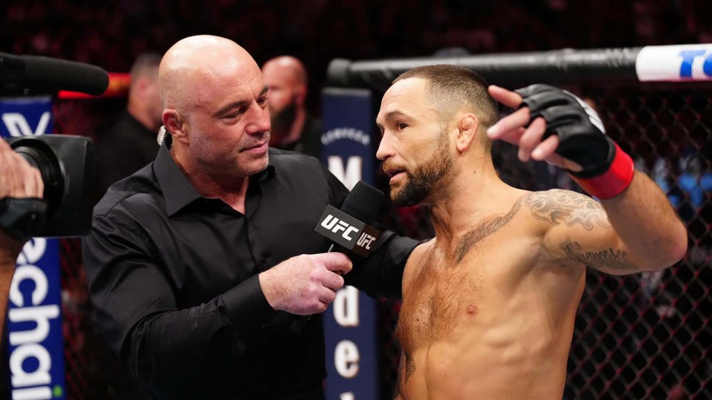 Joe Rogan interviews MMA legend Frankie Edgar post fight inside UFC 281 Octagon wallpaper