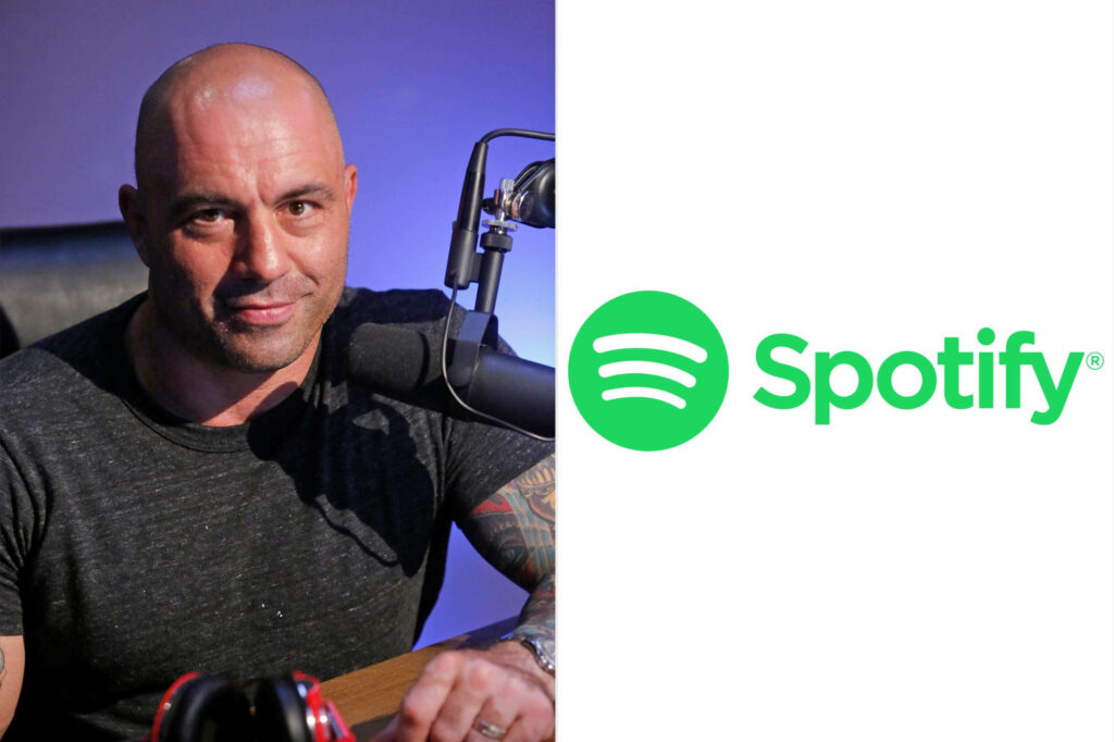 Joe Rogan relaxed podcast host with microphone and Spotify logo white background wallpaper