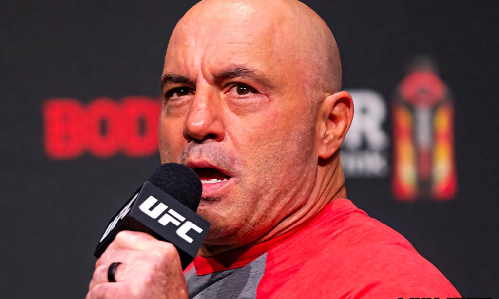 Joe Rogan passionately speaking into UFC microphone at intense live UFC event wallpaper background