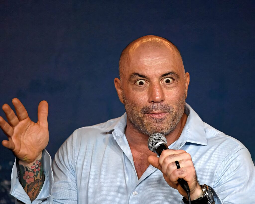 Joe Rogan animated stand-up comedy performance holding microphone ready to tell joke wallpaper