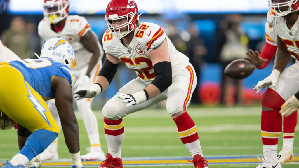 Joe Thuney Action Wallpaper: Vibrant Football Guard Background