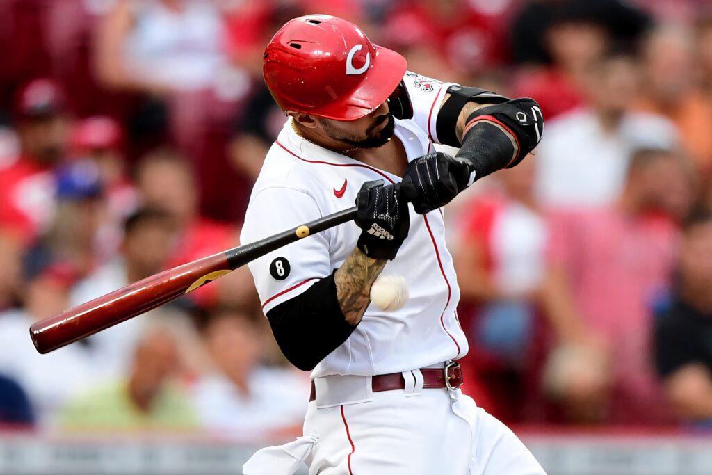 Joey Votto mid-swing Cincinnati Reds wallpaper vibrant red uniform dynamic baseball action