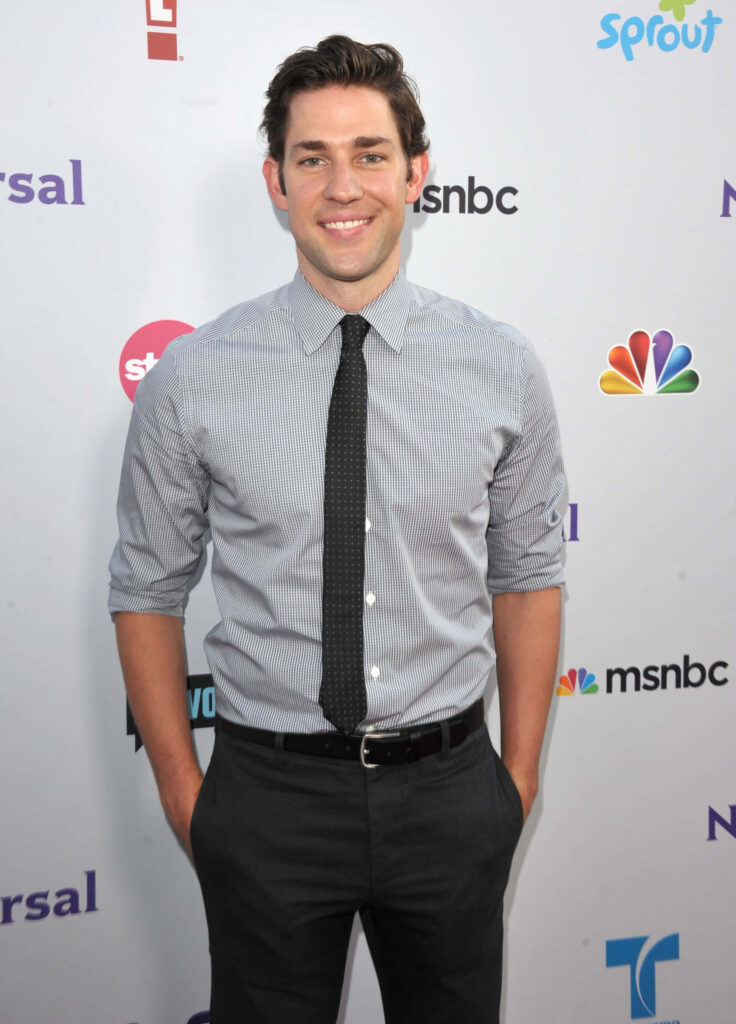John Krasinski in striped shirt and tie confident pose at media event perfect fan wallpaper background