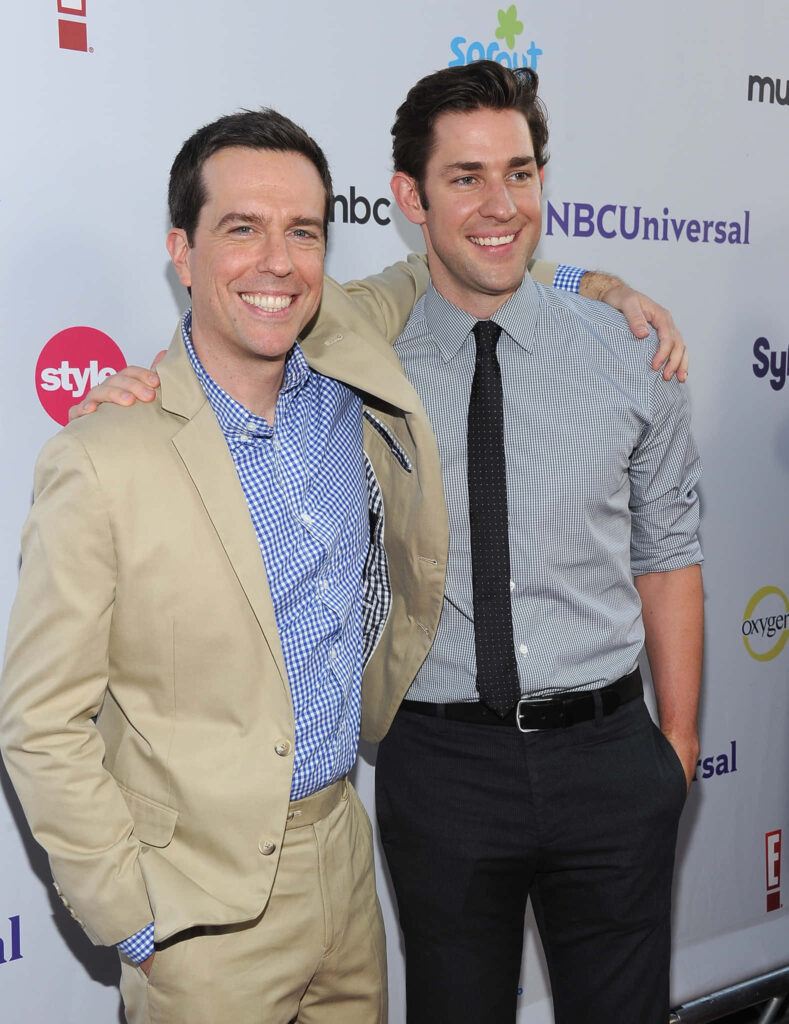 Actors John Krasinski and Ed Helms smiling together at NBC Universal TCA 2011 Press Tour event backdrop Wallpaper