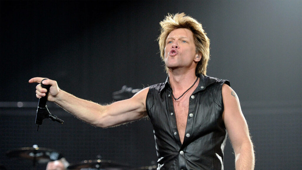 Jon Bon Jovi performing live in sleeveless black leather vest at 2010 O2 Arena London concert Wallpaper