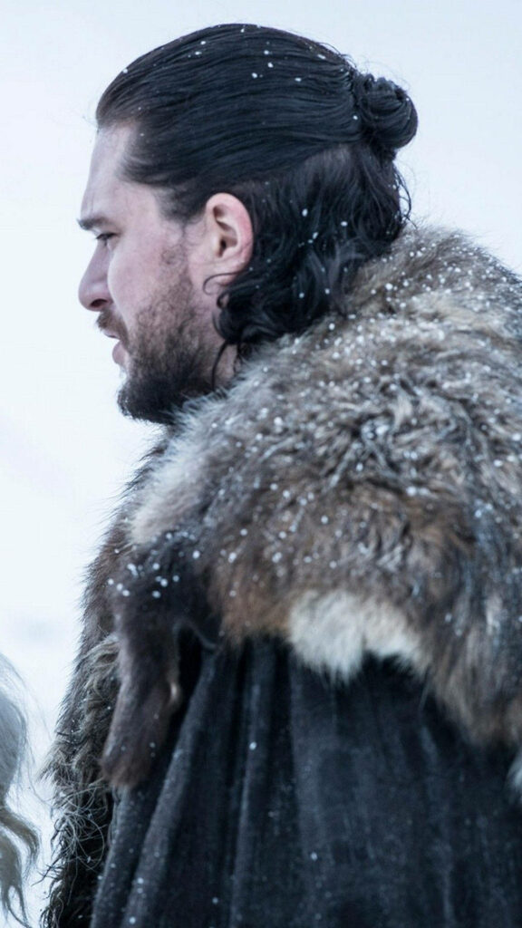 Jon Snow Thoughtful Wallpaper: Snowy Background & Northern Aesthetic