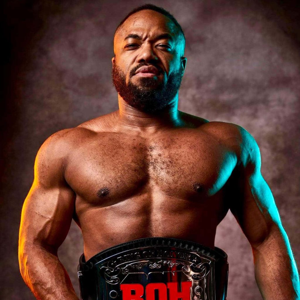 Jonathan Gresham ROH World Champion wrestler posing with title belt dramatic amber teal lighting Wallpaper