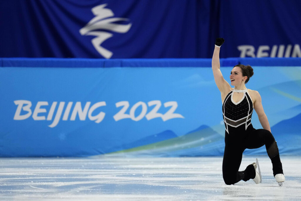Figure skating athlete Josefin Taljegard performing dynamic routine at 2022 Winter Olympics Beijing Wallpaper