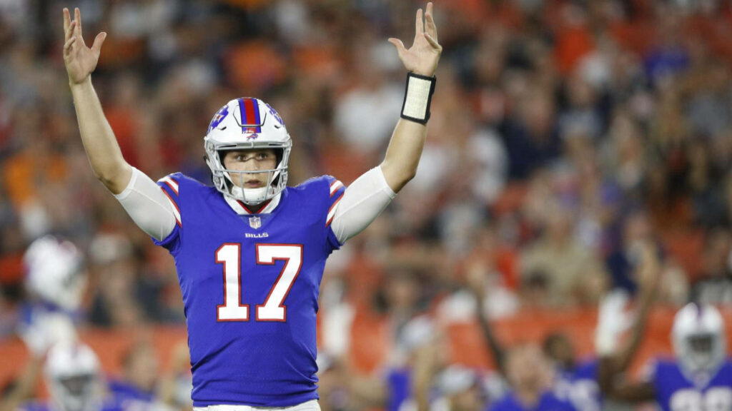 Josh Allen Buffalo Bills number 17 celebrating on field in vibrant blue and red uniform Wallpaper