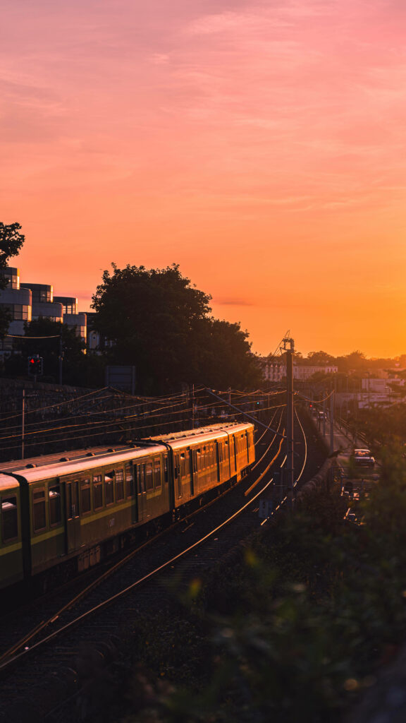 Sunset Serenade: Captivating Colors Embellish the Railway Path Wallpaper