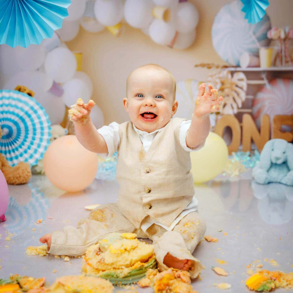 Joyful Baby Cake Smash: Colorful Decorations & Cheerful Background Wallpaper