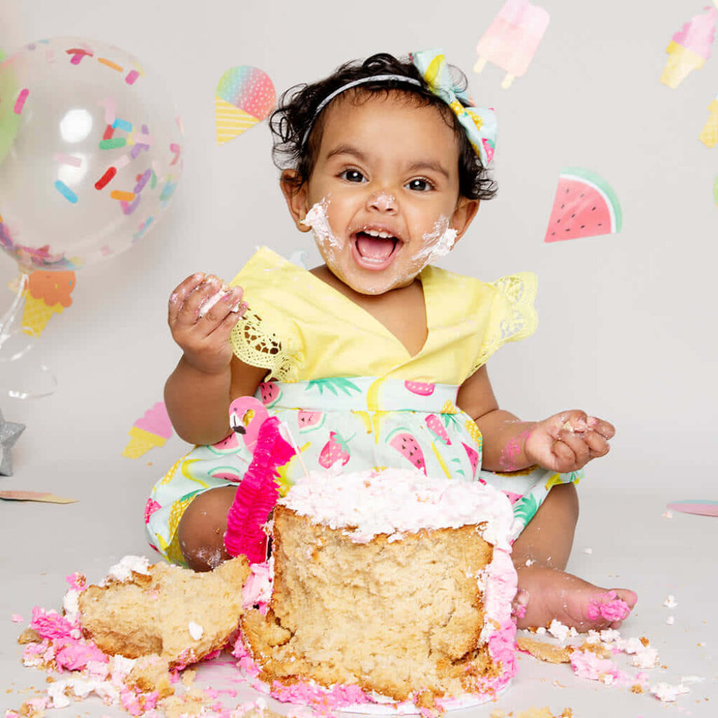 Joyful Baby Girl's Colorful Cake Smash with Balloons & Decor Wallpaper