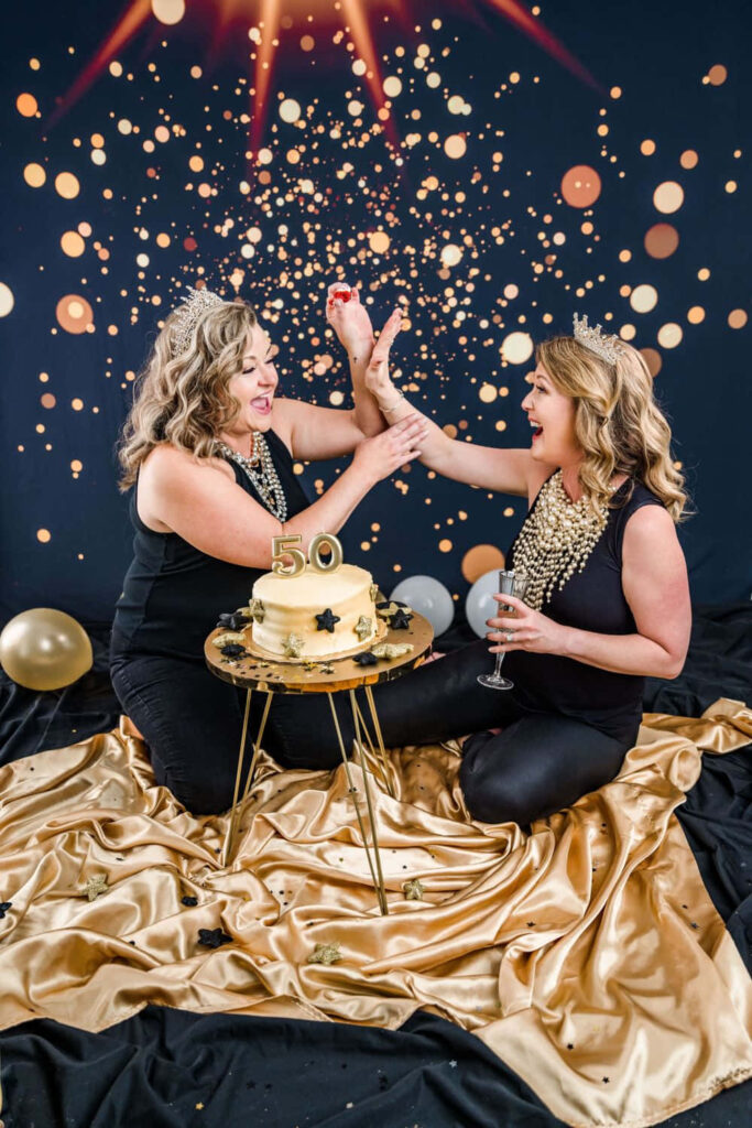 Joyful Cake Smash Celebration with Festive Decorations and Crowns Wallpaper