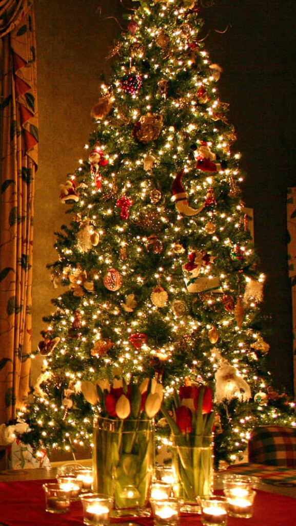Festive Holiday Wallpaper: Joyful Christmas Tree & Candlelit Ambiance