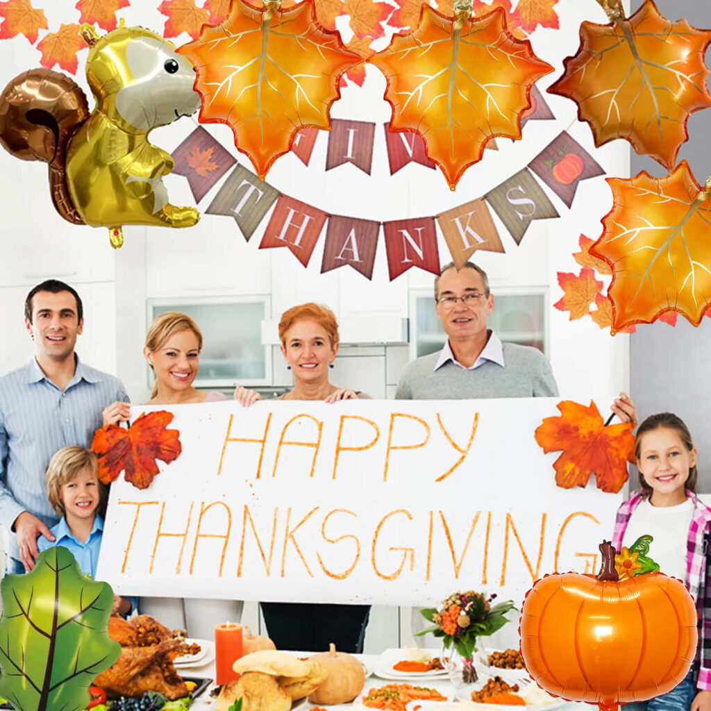 Joyful family in bright kitchen holding Happy Thanksgiving sign with autumn leaves and pumpkin Wallpaper