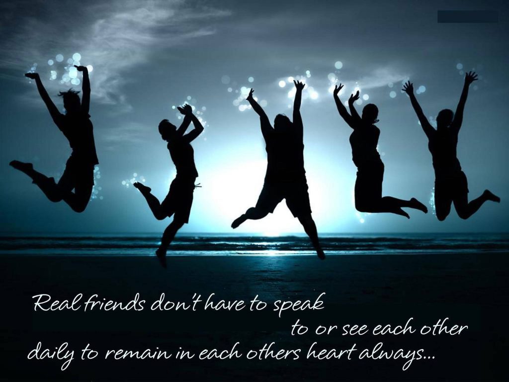 Five friends jumping on glowing twilight beach with heartfelt real friendship quote background Wallpaper