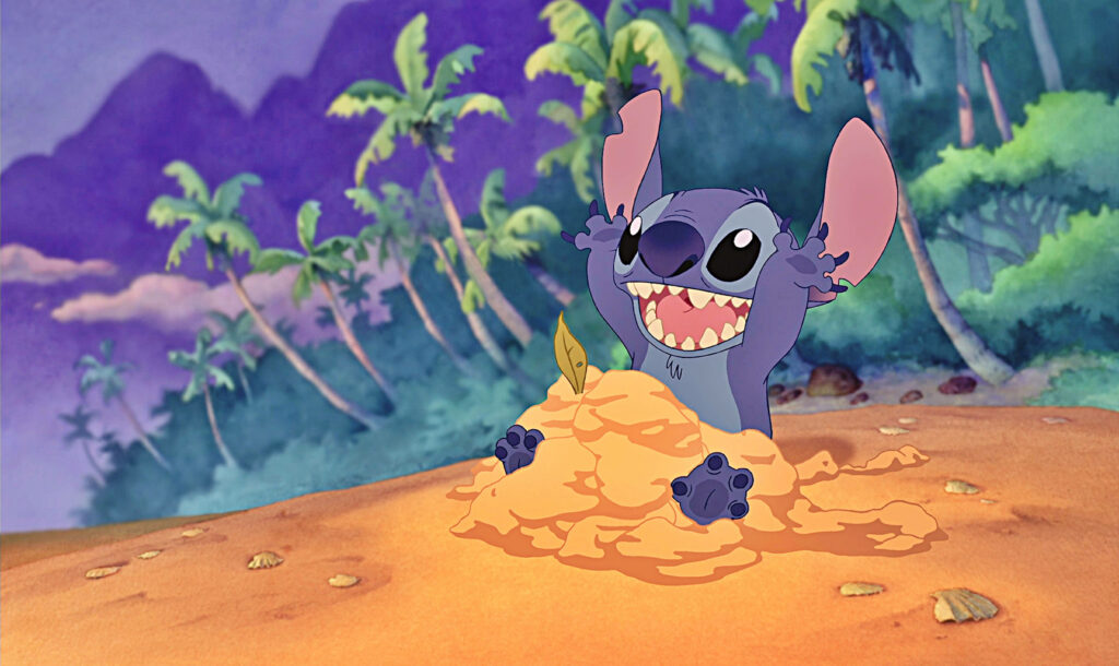 Stitch pops from sand on tropical beach with palm trees and twilight sky Disney wallpaper backdrop