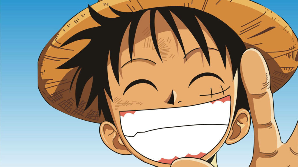 Captivating Close-up: Luffy's Infectious Smile Radiates in Mesmerizing Wallpaper