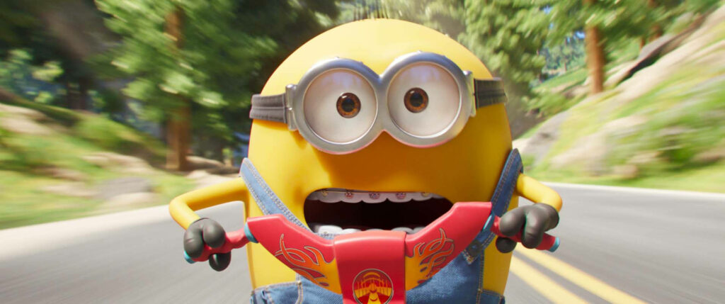 Joyful Minion Riding Bike Wallpaper - Fun Adventure Background