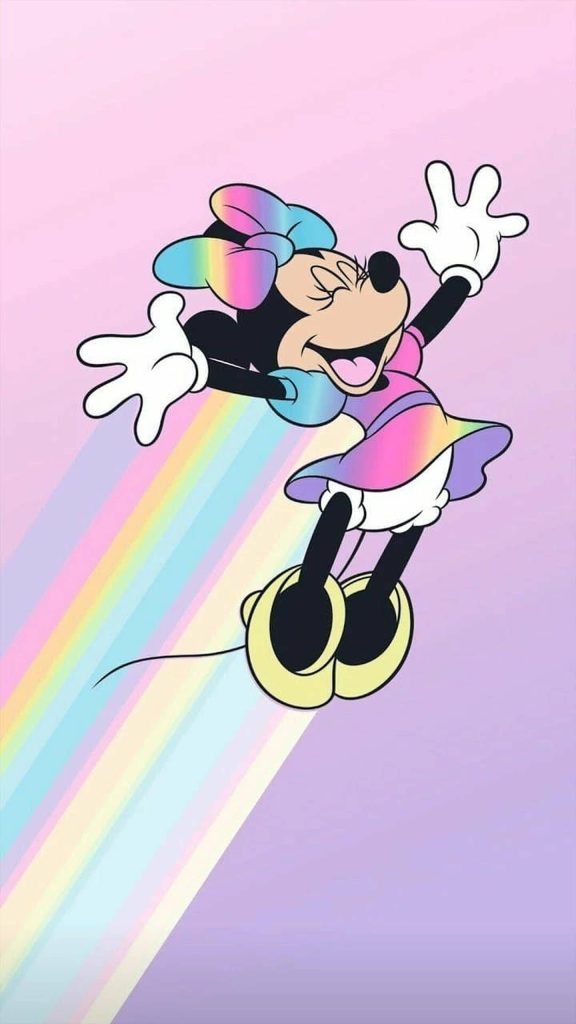 Minnie Mouse in pastel rainbow dress leaps with rainbow trail on soft lavender wallpaper background