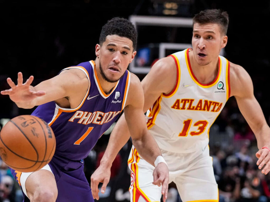 Judah Lame and Bogdan Bogdanović competing intensely for basketball ball during game action Wallpaper
