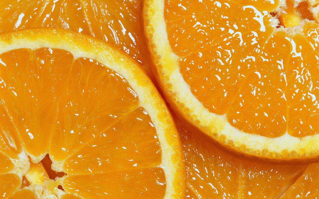 Close-up of juicy fresh orange slices vibrant citrus macro wallpaper background