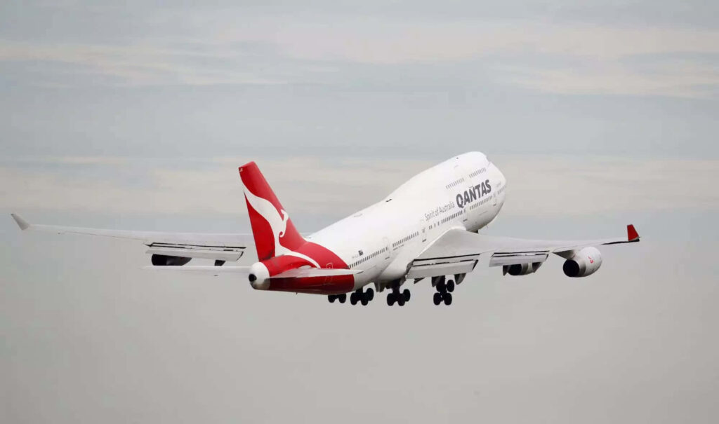 Aerial Symphony: The Majestic Array of Jumbo Jets on an Airport Tarmac Wallpaper