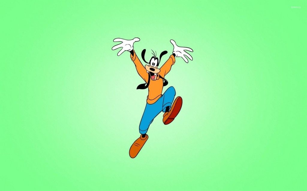 Jumping Goofy wallpaper cheerful Disney character mid-leap orange sweater blue pants light green background