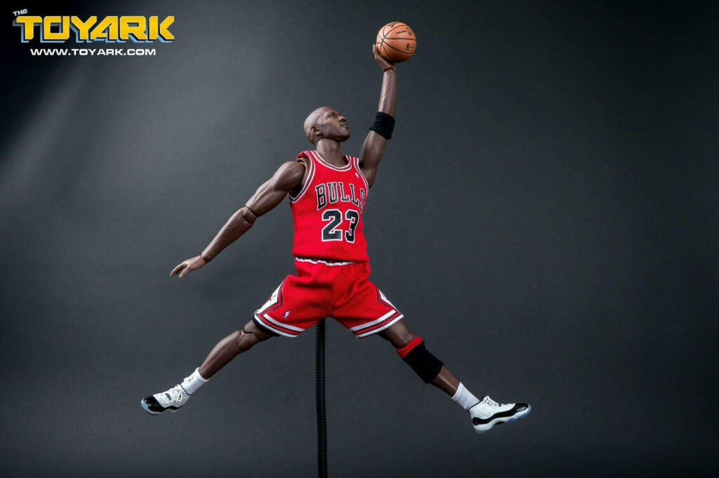 Iconic Air: HD Snapshot of Michael Jordan Strikes the Jumpman Pose in Black Toe Air Jordans Wallpaper