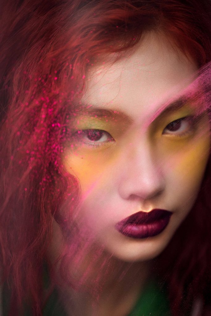 Close-up portrait of Jung Ho-yeon with red lighting glitter bold plum lips yellow eyeshadow wallpaper