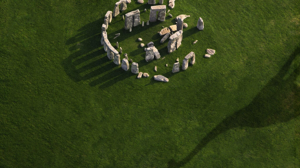 Stunning Aerial Wallpaper: Ancient Stone Formations & Dinosaur Shadow