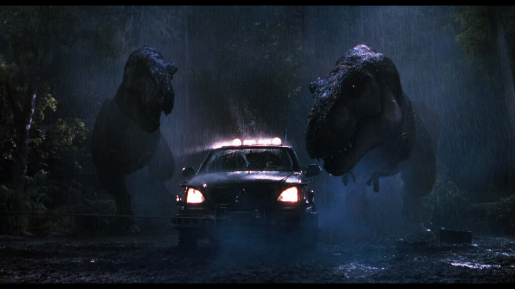 Iconic *Jurassic Park* T-Rex Showdown Wallpaper Background