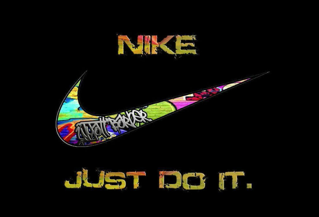 Bold Nike Graffiti: Empowering Wallpaper with 'Just Do It' Motto