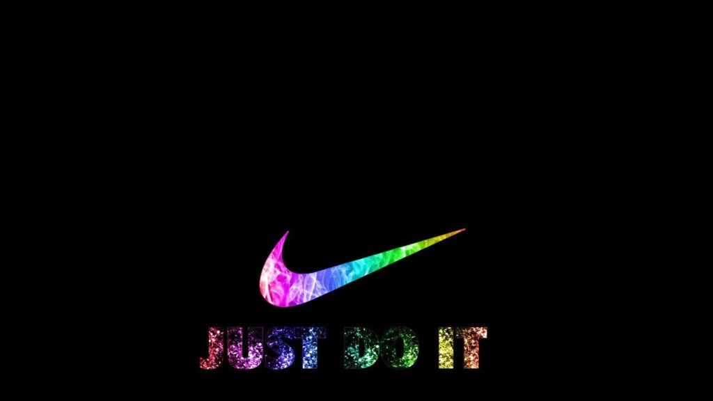 Bold Nike logo and Just Do It slogan on colorful gradient black background sports wallpaper