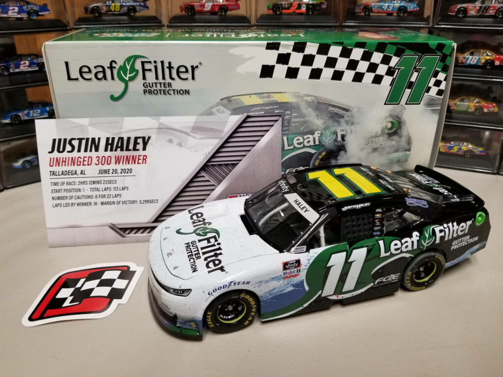 Miniature model of Justin Haley LeafFilter No 11 race car with Talladega Unhinged 300 win backdrop Wallpaper
