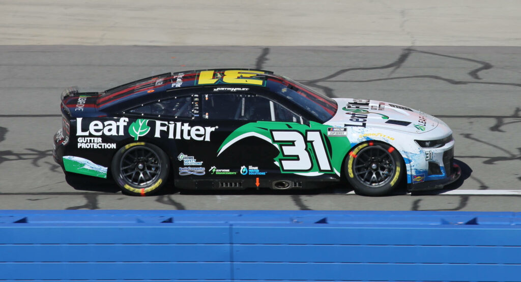 Justin Haley race car number 31 with LeafFilter Gutter Protection branding on racetrack background Wallpaper