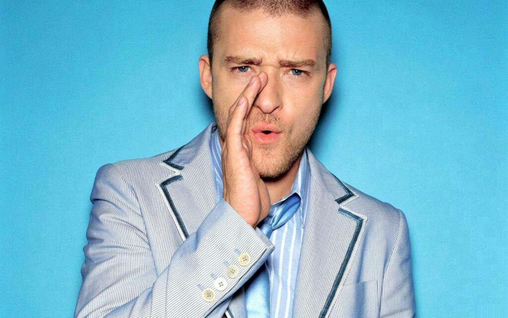 Justin Timberlake Whistling in Light Suit - Bright Blue Wallpaper