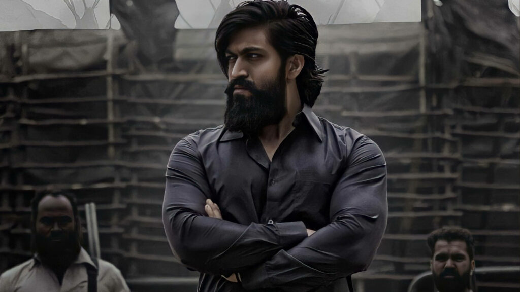 KGF's Fierce Rocky: 4K Wallpaper Featuring an Epic Standoff with Armed Men in the Film's Setting