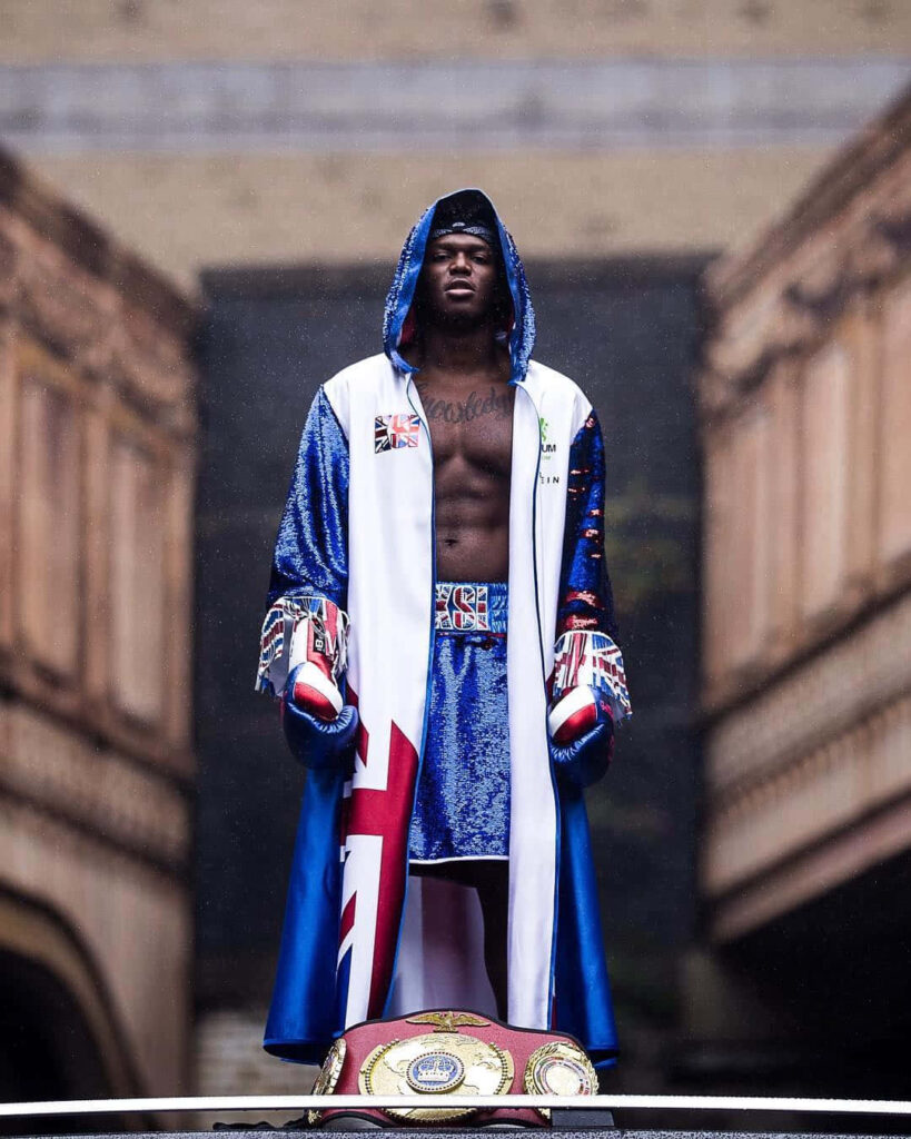 KSI in British flag boxing robe with championship belt showcasing rapper boxer influencer roles Wallpaper