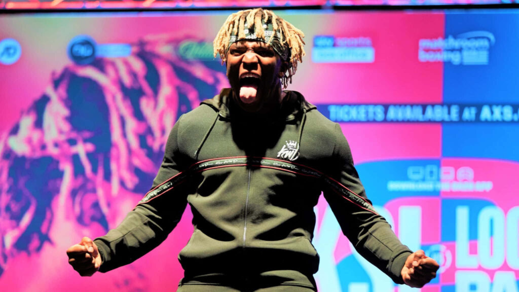 KSI pumped up energetic British influencer boxer musician vibrant colorful wallpaper background