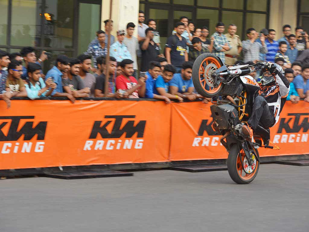 Thrilling KTM Bike Stunt Wallpaper: Dynamic Event Scene